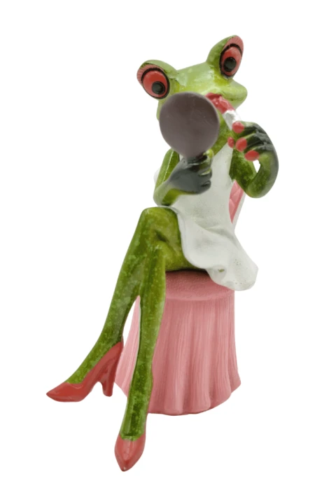 Figurka żaba w białej sukience robiąca makijaż4.png