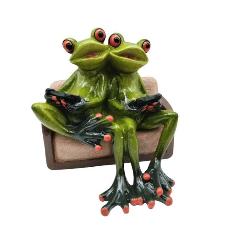 Figurka „Żaby gamerzy” – humorystyczna dekoracja inspirowana światem gier.